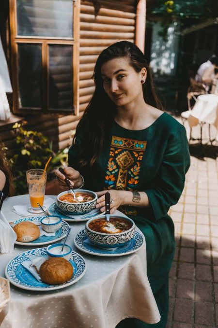 a young woman sitting in a restaurant